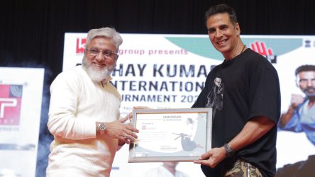 Dr. Faruk G. Patel, together with Vispy Kharadi, Disha Patani, and Akshay Kumar, attended the 15th International Kudo Tournament held at the Surat VNSGU Convention Center. When Dr. Faruk G. Patel received a certificate of honor By Akshay Kumar